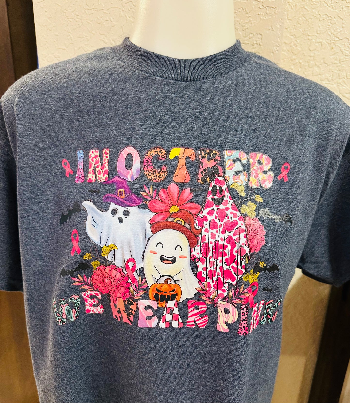 3 GHOST wearing pink graphic tee